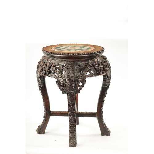 591 - A 19TH CENTURY CHINESE HARDWOOD JARDINIERE STAND WITH CANTON PORCELAIN TOP having pierced carved lea... 