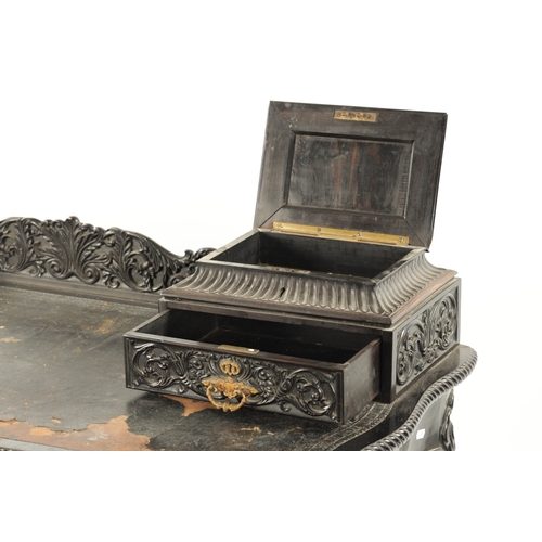 593 - A 19TH CENTURY CARVED COROMANDEL INDO-PORTUGUESE WRITING DESK of serpentine shape with leaf-carved d... 