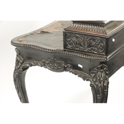 593 - A 19TH CENTURY CARVED COROMANDEL INDO-PORTUGUESE WRITING DESK of serpentine shape with leaf-carved d... 