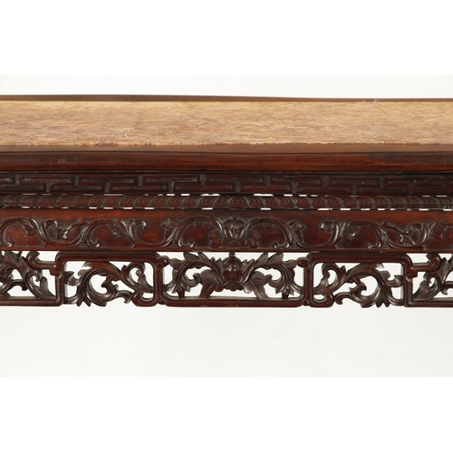 598 - A 19TH CENTURY CHINESE HARDWOOD ALTER TABLE with inset marble top above peirced carved leafwork base... 