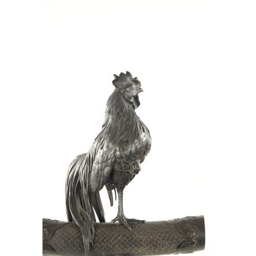 601 - A FINE LARGE JAPANESE MEIJI PERIOD PATINATED BRONZE SCULPTURE modelled as a cockerel holding its leg... 