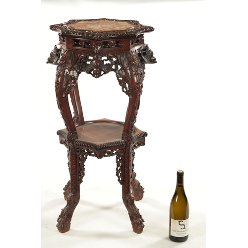 605 - A 19TH CENTURY CHINESE CARVED HARDWOOD JARDINIERE STAND the shaped top with carved border enclosing ... 