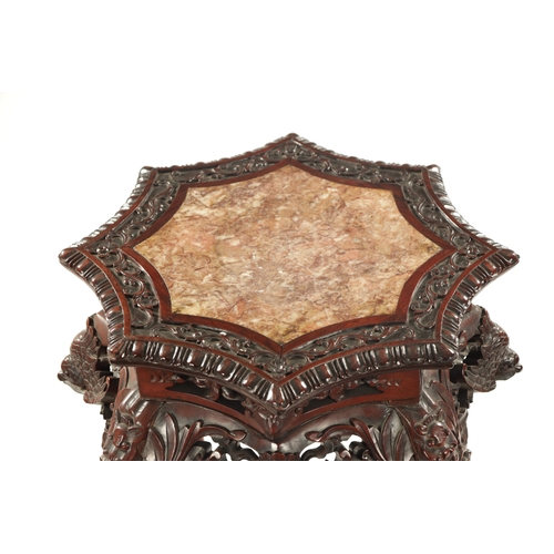 605 - A 19TH CENTURY CHINESE CARVED HARDWOOD JARDINIERE STAND the shaped top with carved border enclosing ... 