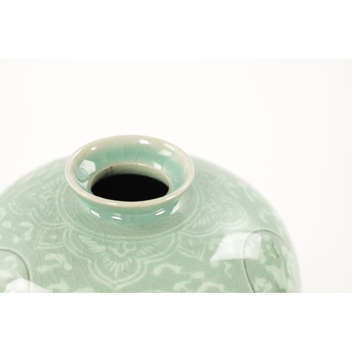 607 - A SIGNED KOREAN CELADON CRACKLE GLAZED VASE decorated with flying cranes amongst clouds, signed to u... 