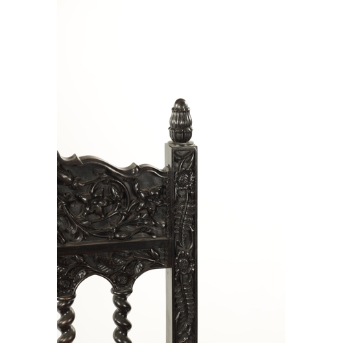 608 - A GOOD 18TH CENTURY CARVED INDIAN COROMANDEL COAST EBONY ARMCHAIR with leaf carved frame, barley twi... 