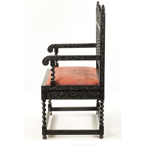 608 - A GOOD 18TH CENTURY CARVED INDIAN COROMANDEL COAST EBONY ARMCHAIR with leaf carved frame, barley twi... 