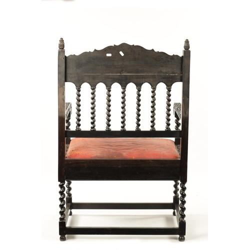 608 - A GOOD 18TH CENTURY CARVED INDIAN COROMANDEL COAST EBONY ARMCHAIR with leaf carved frame, barley twi... 