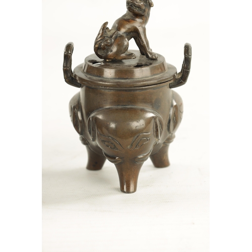 609 - A PAIR OF CHINESE LIDDED INCENSE BURNERS two-handled bodies with foo dog finials and elephant mask l... 