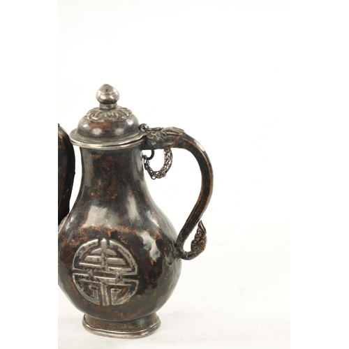 617 - A 19TH CENTURY MINIATURE EASTERN MIXED METAL EWER with a calligraphic symbol on each side and dragon... 