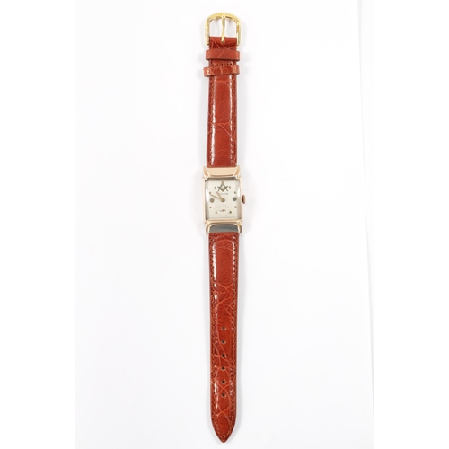 630 - A 1940’S ROLLED GOLD BULOVA MASONIC WRISTWATCH on brown alligator leather strap, the slightly curved... 