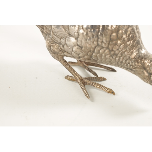 665 - AN EARLY 20TH CENTURY SILVER SCULPTURE OF COCK PHEASANT modelled with low pecking head - hallmarked ... 