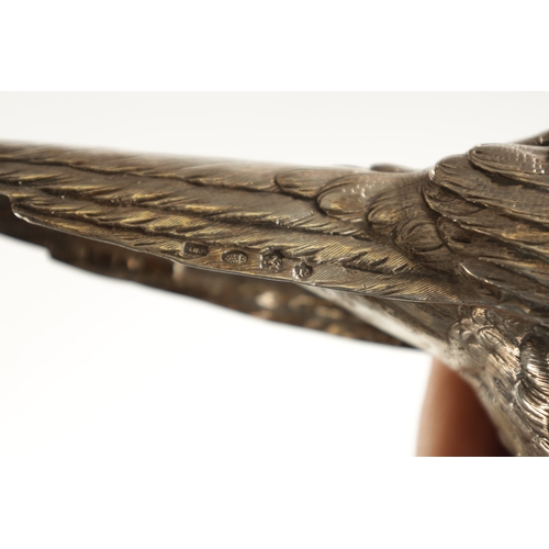 665 - AN EARLY 20TH CENTURY SILVER SCULPTURE OF COCK PHEASANT modelled with low pecking head - hallmarked ... 