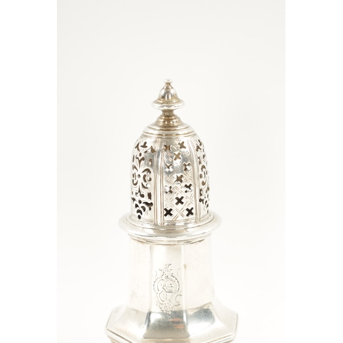 667 - A GEORGE II SILVER SUGAR CASTER of crested faceted baluster form, domed cover and turned finial. Lon... 