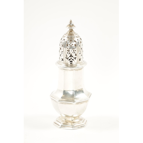 667 - A GEORGE II SILVER SUGAR CASTER of crested faceted baluster form, domed cover and turned finial. Lon... 