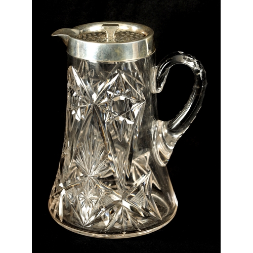 668 - AN EARLY 20TH CENTURY CUT GLASS AND SILVER MOUNTED LEMONADE JUG of tapering form with twist off pier... 