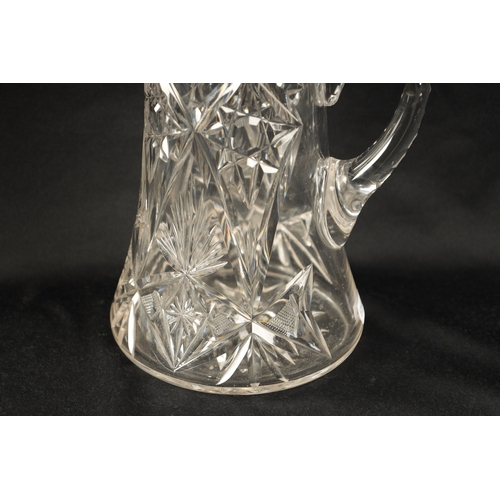 668 - AN EARLY 20TH CENTURY CUT GLASS AND SILVER MOUNTED LEMONADE JUG of tapering form with twist off pier... 