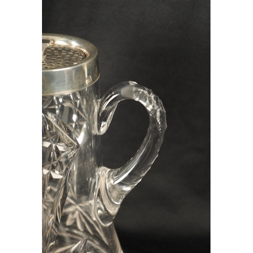 668 - AN EARLY 20TH CENTURY CUT GLASS AND SILVER MOUNTED LEMONADE JUG of tapering form with twist off pier... 