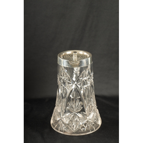 668 - AN EARLY 20TH CENTURY CUT GLASS AND SILVER MOUNTED LEMONADE JUG of tapering form with twist off pier... 