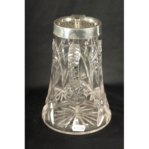 668 - AN EARLY 20TH CENTURY CUT GLASS AND SILVER MOUNTED LEMONADE JUG of tapering form with twist off pier... 