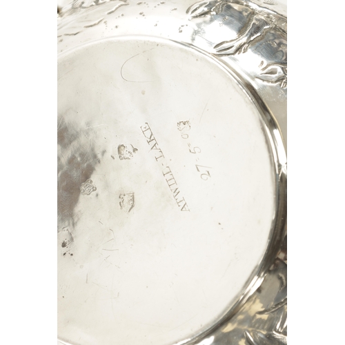 669 - A FINE CHARLES II OVERSIZED SILVER PORRINGER of bellied form embossed with a continuous band of leaf... 