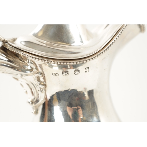 672 - A STYLISH GEORGE III SILVER WINE EWER of crested pedestal form in the classical 'Adam' design with a... 