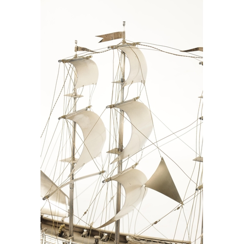 673 - A 20TH CENTURY SILVER MODEL OF THE FAMOUS HMS BOUNTY SHIP the three masted sailing ship with sails a... 