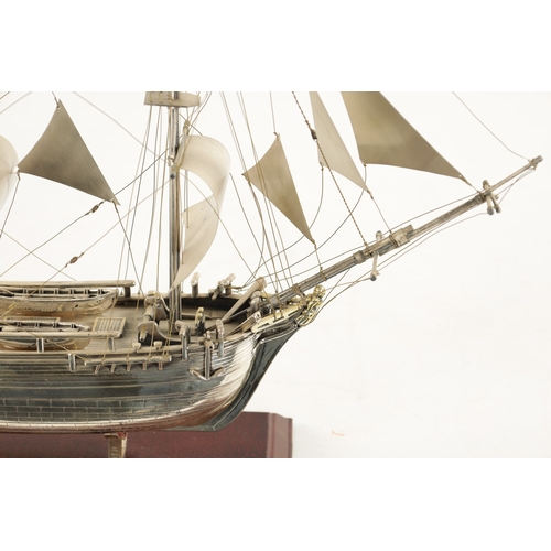 673 - A 20TH CENTURY SILVER MODEL OF THE FAMOUS HMS BOUNTY SHIP the three masted sailing ship with sails a... 