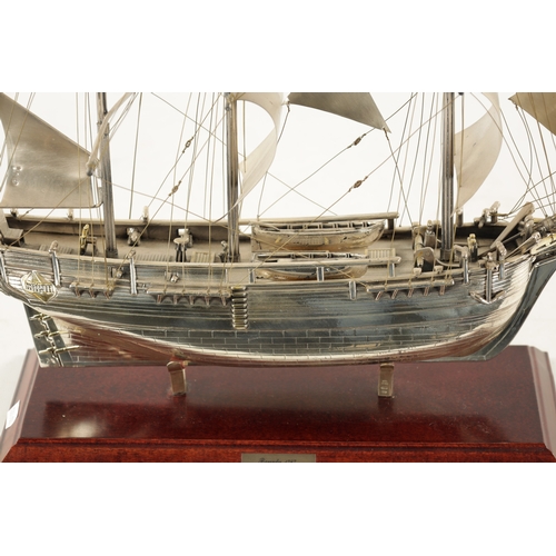 673 - A 20TH CENTURY SILVER MODEL OF THE FAMOUS HMS BOUNTY SHIP the three masted sailing ship with sails a... 