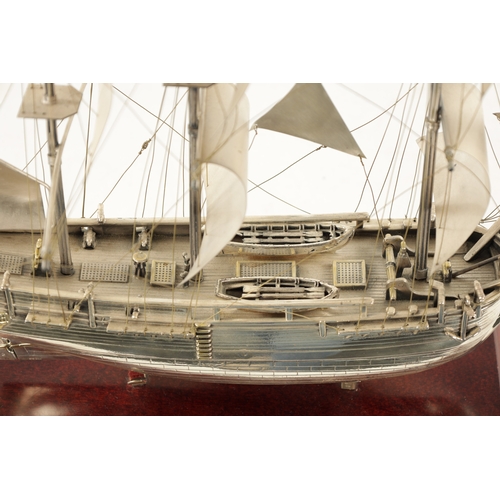 673 - A 20TH CENTURY SILVER MODEL OF THE FAMOUS HMS BOUNTY SHIP the three masted sailing ship with sails a... 