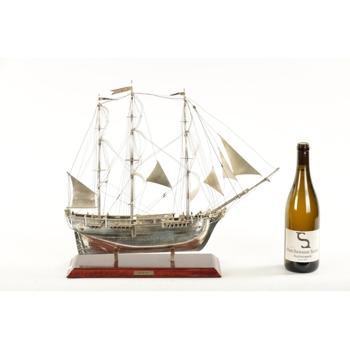 673 - A 20TH CENTURY SILVER MODEL OF THE FAMOUS HMS BOUNTY SHIP the three masted sailing ship with sails a... 