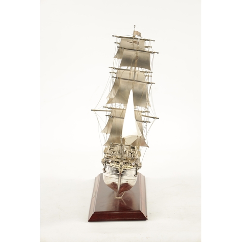 673 - A 20TH CENTURY SILVER MODEL OF THE FAMOUS HMS BOUNTY SHIP the three masted sailing ship with sails a... 