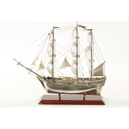 673 - A 20TH CENTURY SILVER MODEL OF THE FAMOUS HMS BOUNTY SHIP the three masted sailing ship with sails a... 