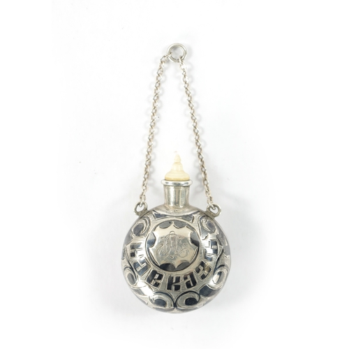 674 - A 19TH CENTURY RUSSIAN NIELLO SILVER SCENT BOTTLE AND BONE STOPPER decorated with scrollwork. 18g (4... 