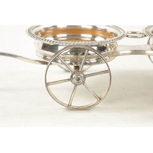 680 - A 19TH CENTURY NOVELTY SILVER PLATED TABLE TOP DOUBLE COASTER TROLLEY FORMED AS A CARRIAGE with ivor... 