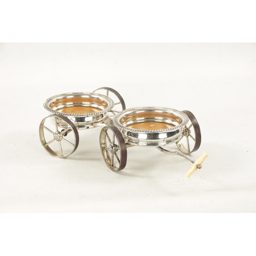 680 - A 19TH CENTURY NOVELTY SILVER PLATED TABLE TOP DOUBLE COASTER TROLLEY FORMED AS A CARRIAGE with ivor... 