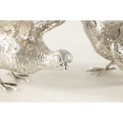 682 - A PAIR OF 20TH CENTURY MAPPIN & WEBB SILVER PHEASANTS realistically modelled as a hen and cock pheas... 