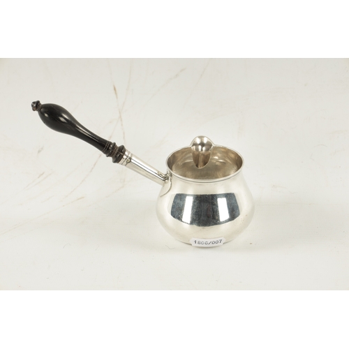 690 - A GEORGE III SILVER BRANDY WARMER with turned ebony handle, app. Weight 118g - Walter Brind, London.... 