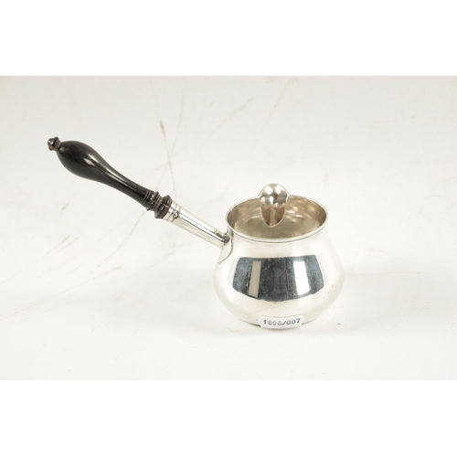 690 - A GEORGE III SILVER BRANDY WARMER with turned ebony handle, app. Weight 118g - Walter Brind, London.... 