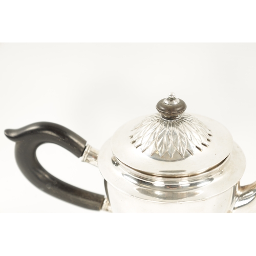 700 - AN EARLY 19TH CENTURY CONTINENTAL SILVER TEAPOT - POSSIBLY BALTIC of plain and leaf cast design with... 