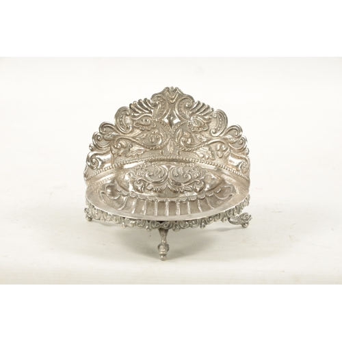 702 - AN EARLY 19TH CENTURY SOUTH AMERICAN SILVER DISH with embossed floral gallery and planished scallop-... 