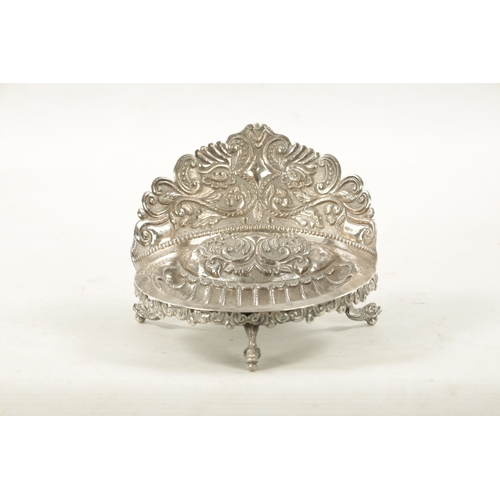 702 - AN EARLY 19TH CENTURY SOUTH AMERICAN SILVER DISH with embossed floral gallery and planished scallop-... 