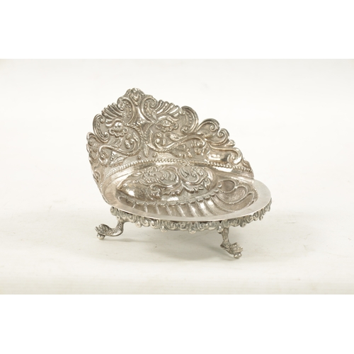 702 - AN EARLY 19TH CENTURY SOUTH AMERICAN SILVER DISH with embossed floral gallery and planished scallop-... 