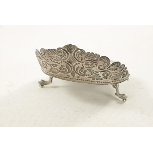 702 - AN EARLY 19TH CENTURY SOUTH AMERICAN SILVER DISH with embossed floral gallery and planished scallop-... 