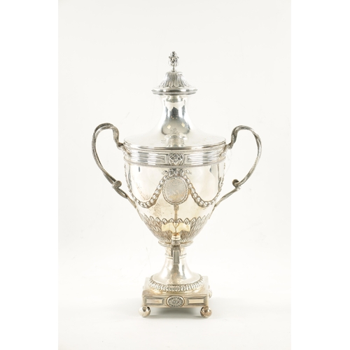 703 - A GOOD GEORGE III SILVER ADAM-STYLE TEA URN with leaf cast finial and coat of arms to the lift of li... 