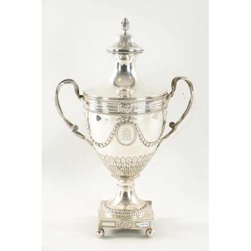 703 - A GOOD GEORGE III SILVER ADAM-STYLE TEA URN with leaf cast finial and coat of arms to the lift of li... 