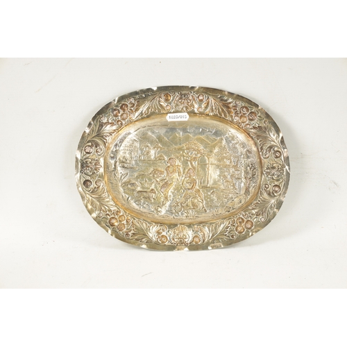 707 - AN 18TH CENTURY GERMAN REPOUSSE SILVER AND SILVER GILT OVAL CHARGER depicting a classical romantic g... 