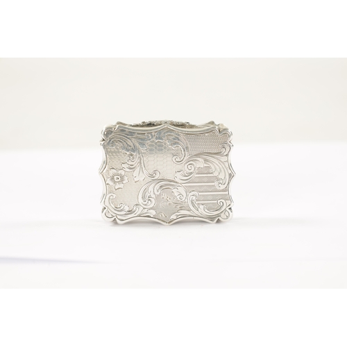 709 - A NATHANIEL MILLS MID 19TH CENTURY SILVER VINAIGRETTE of shaped rectangular form, rococo florally en... 