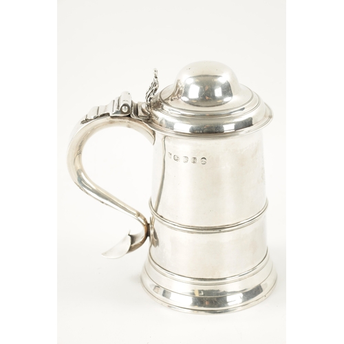 712 - A GEORGE III SILVER TANKARD of plain monogrammed tapering footed form with ribbed girdle, dome cover... 