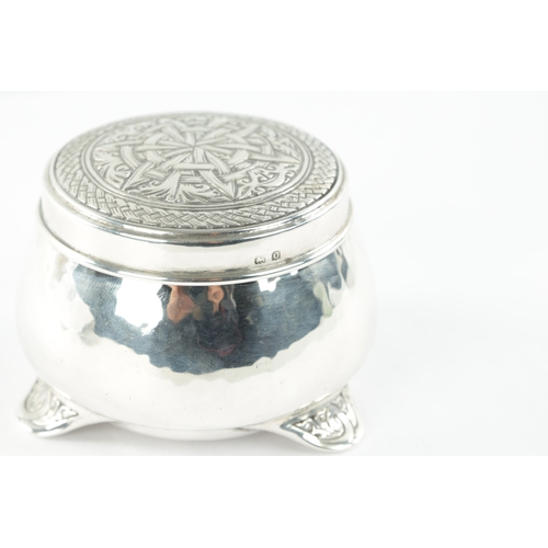 713 - A LIBERTY & CO. ARTS AND CRAFTS SILVER LIDDED BOX DESIGNED BY BERNARD CUZNER the cauldron shaped box... 