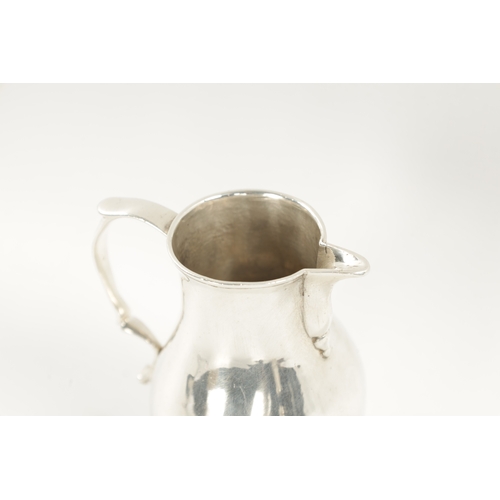 721 - AN EARLY GEORGIAN SILVER CREAM JUG of sparrow beak baluster form with scroll handle. Chester marks b... 